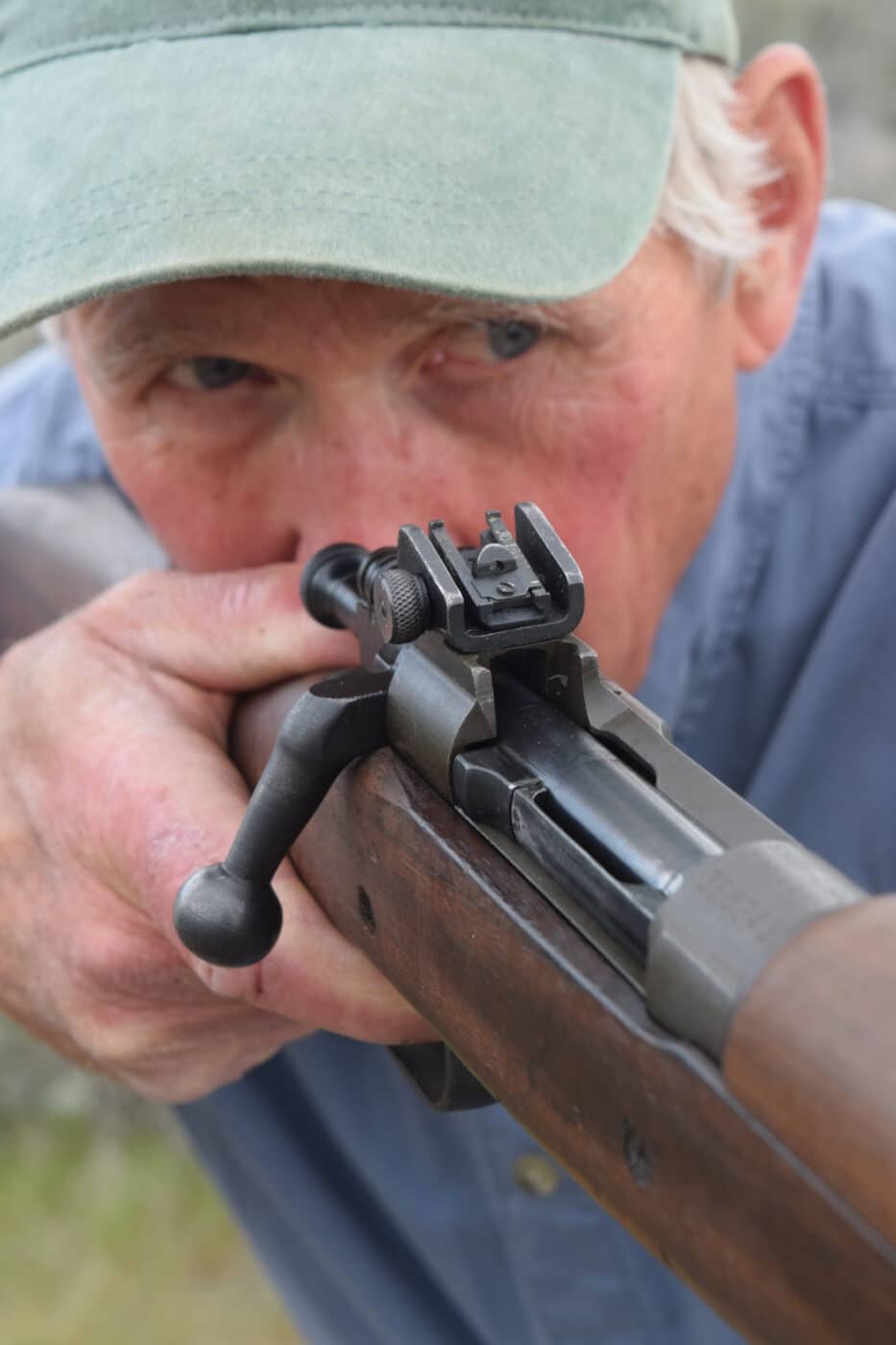 Man shooting a 1903A3 Springfield rifle