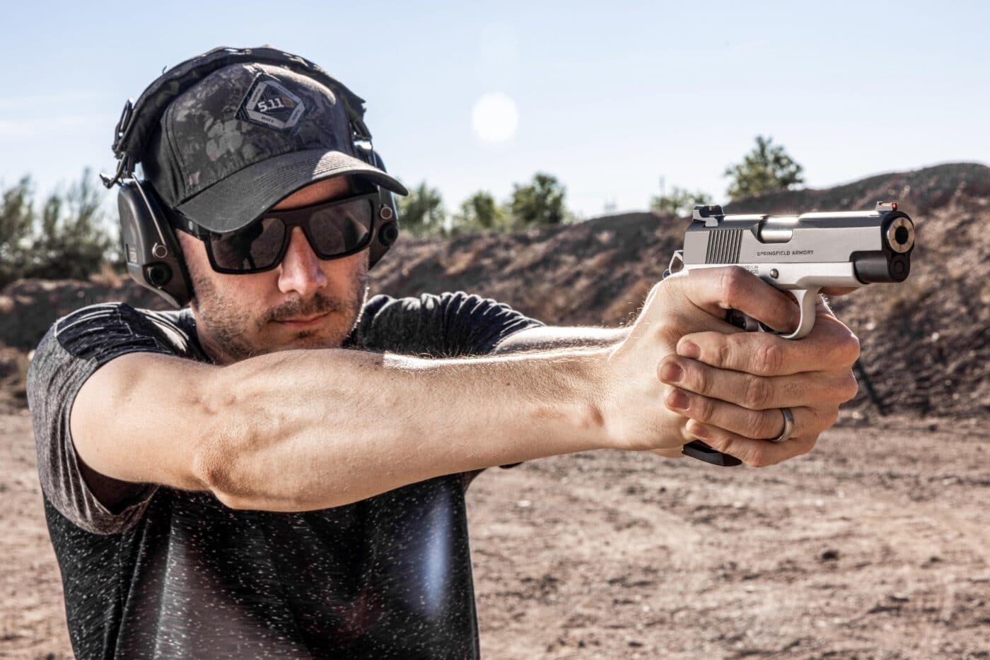 Man shooting a Ronin EMP 4" pistol