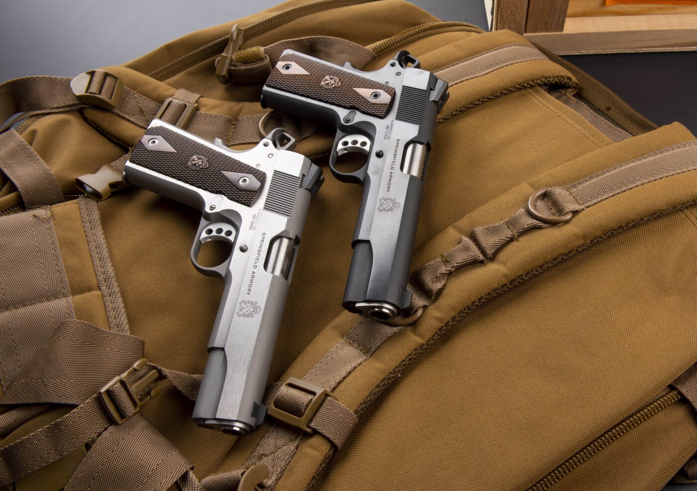 Two versions of the Garrison 1911 pistol by Springfield Armory
