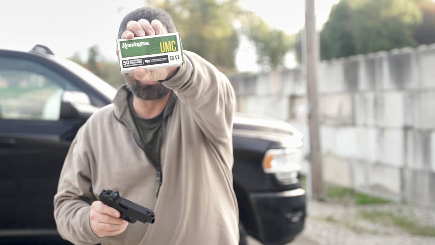 Man holding Remington ammo used in testing