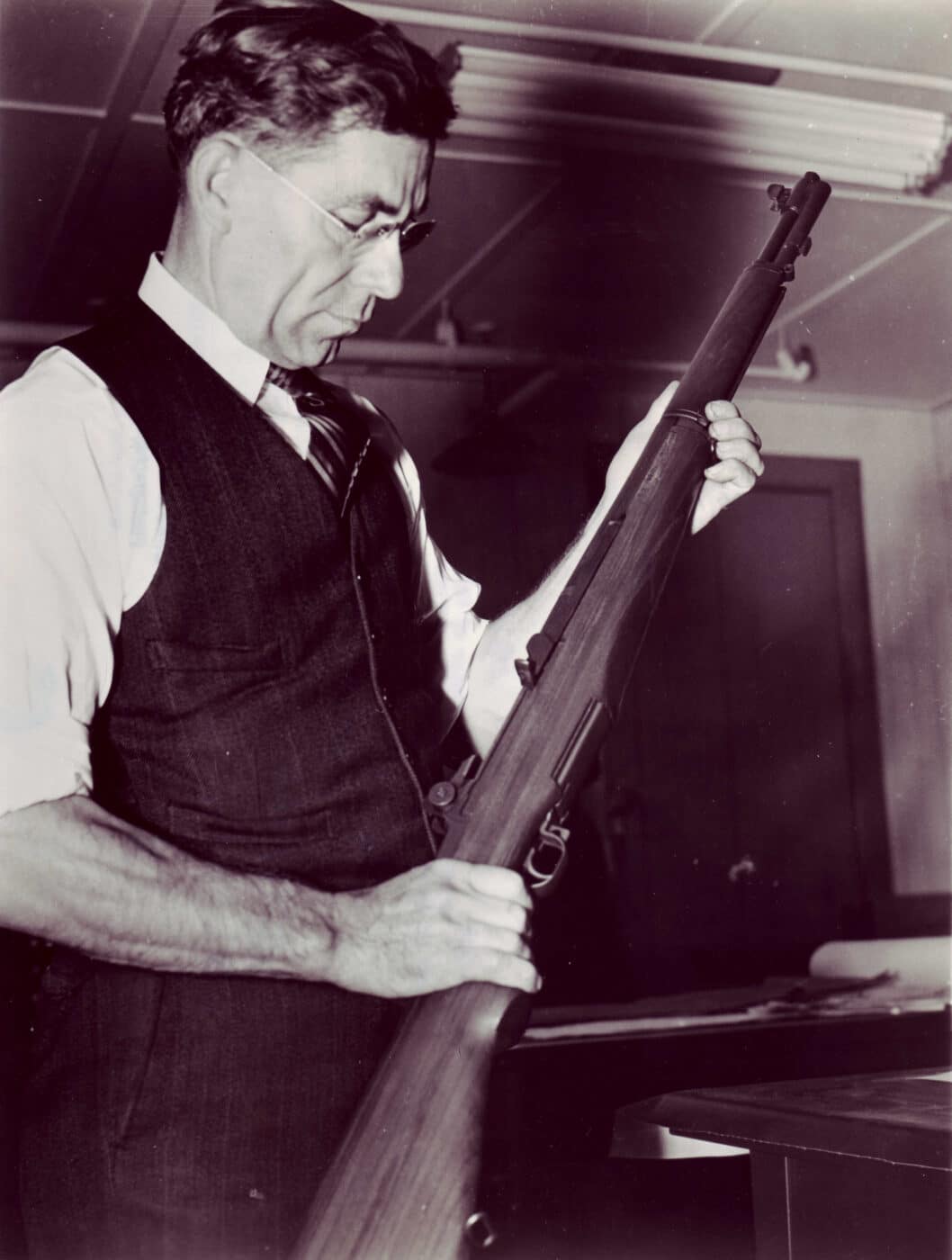 John Garand with early gas trap M1 rifle