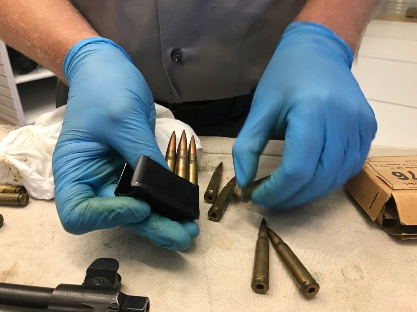 Man loading dummy .276 cartridges