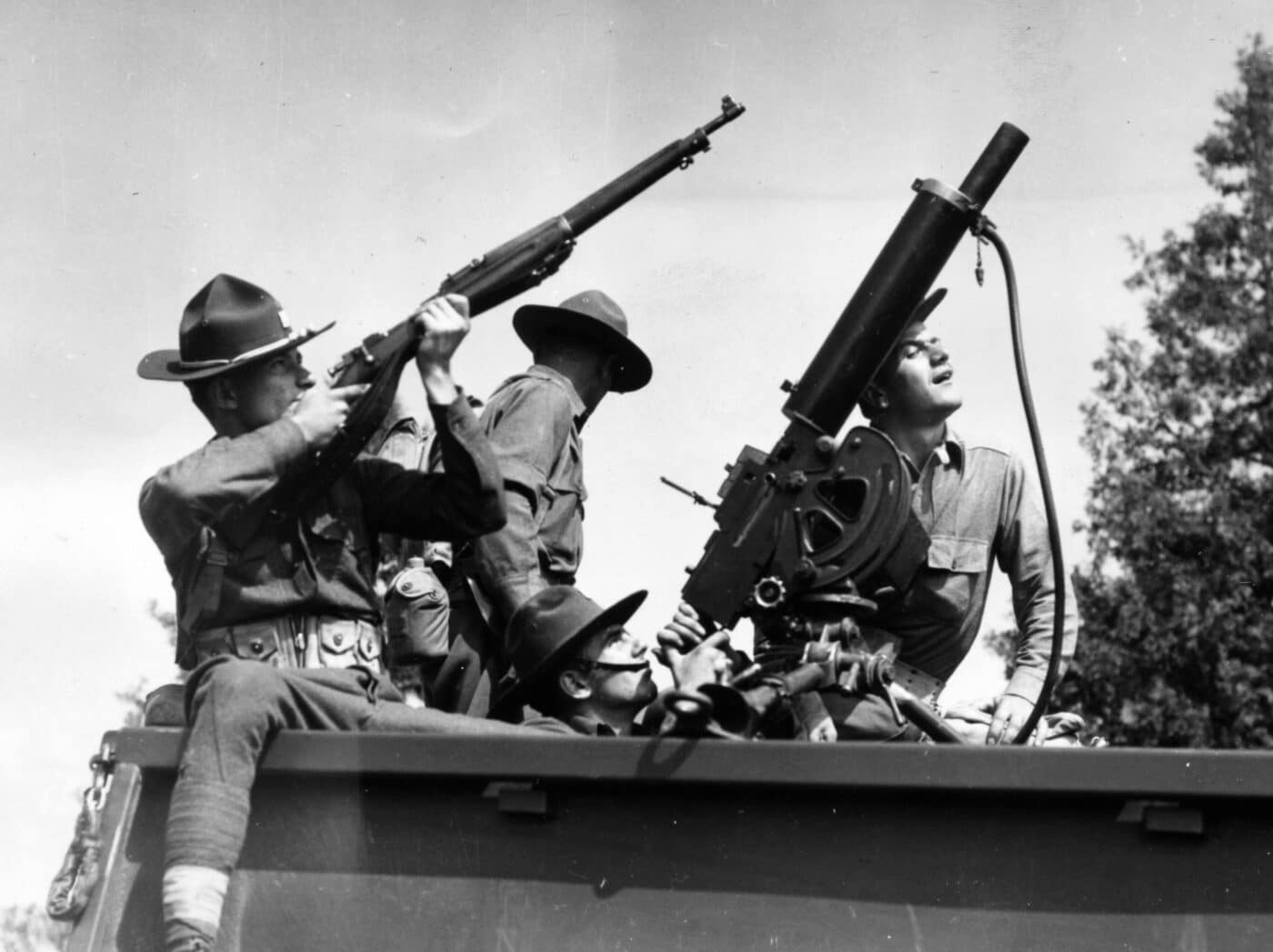 Soldiers with a variety of weapons at Pine Camp in the late 1930s