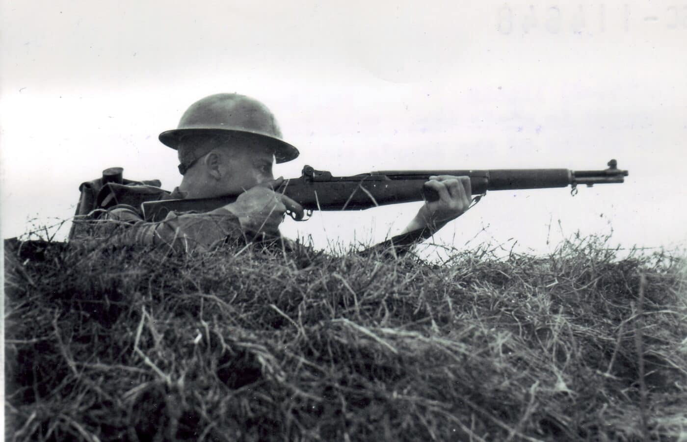Soldier shooting M1 at Fort Benning in 1940