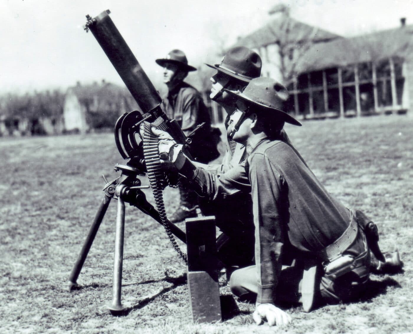 Soldiers next to an M1917 machine gun being used as an AA gun