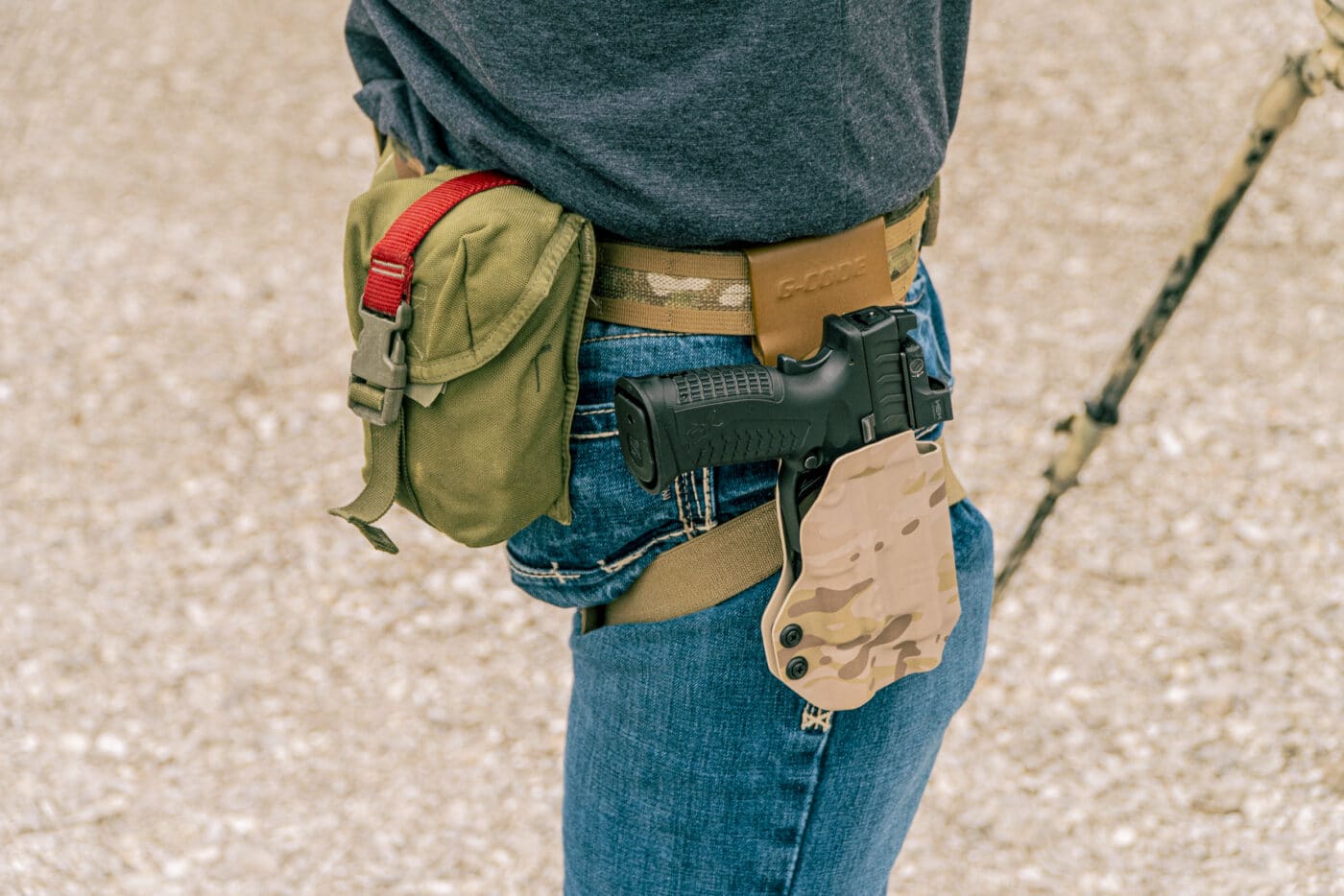 Man wearing Blue Alpha belt with pistol in holster