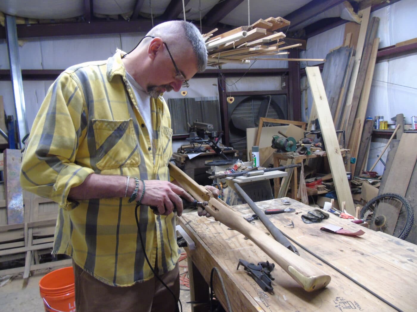 Man restoring a Brown Bess rifle