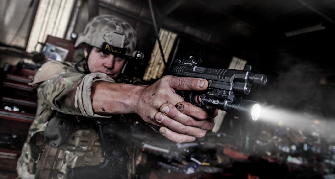 SWAT member with pistol and weaponlight