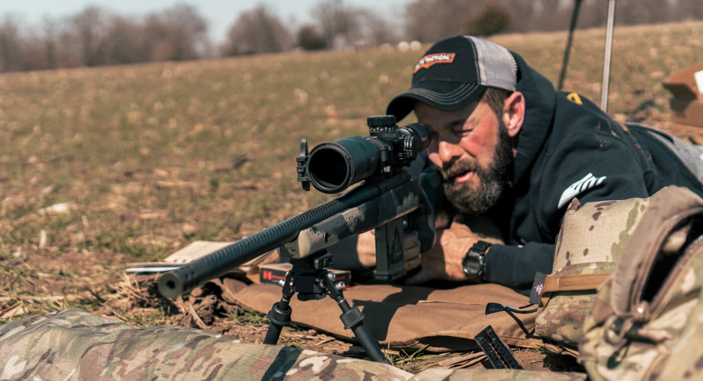 Man engaging moving targets with a rifle