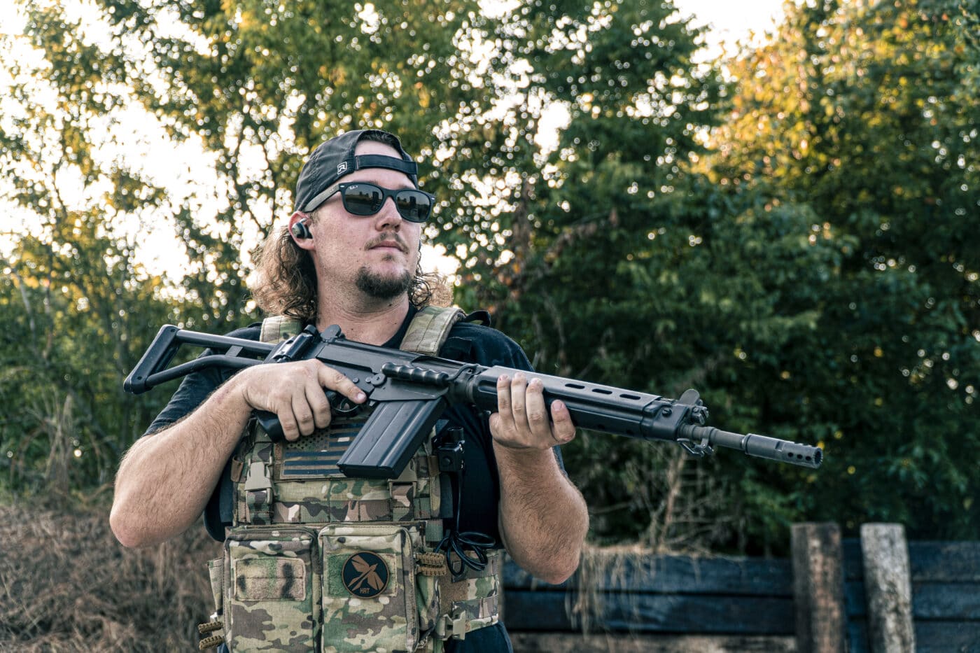 Man holding SAR-48 rifle