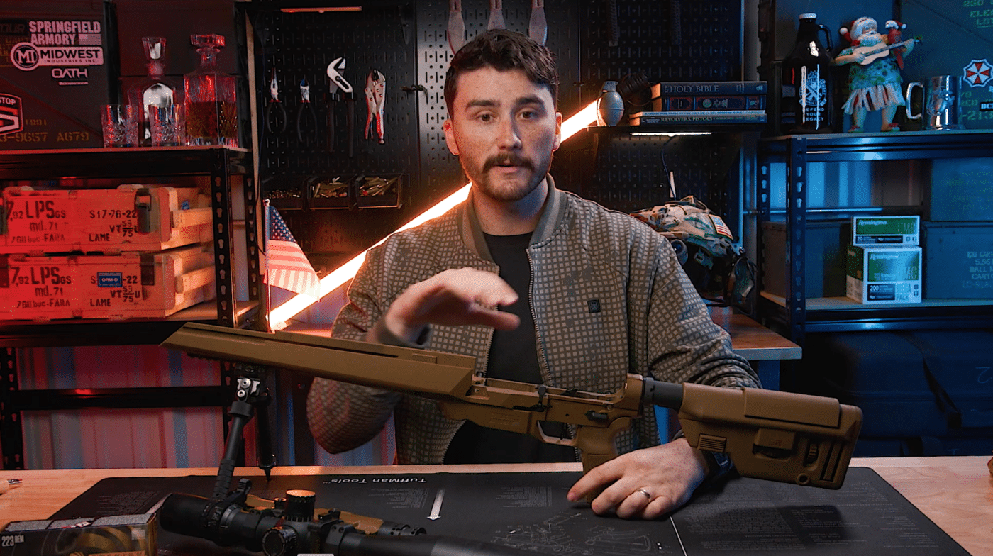 Man with SAINT Edge ATC rifle on workbench