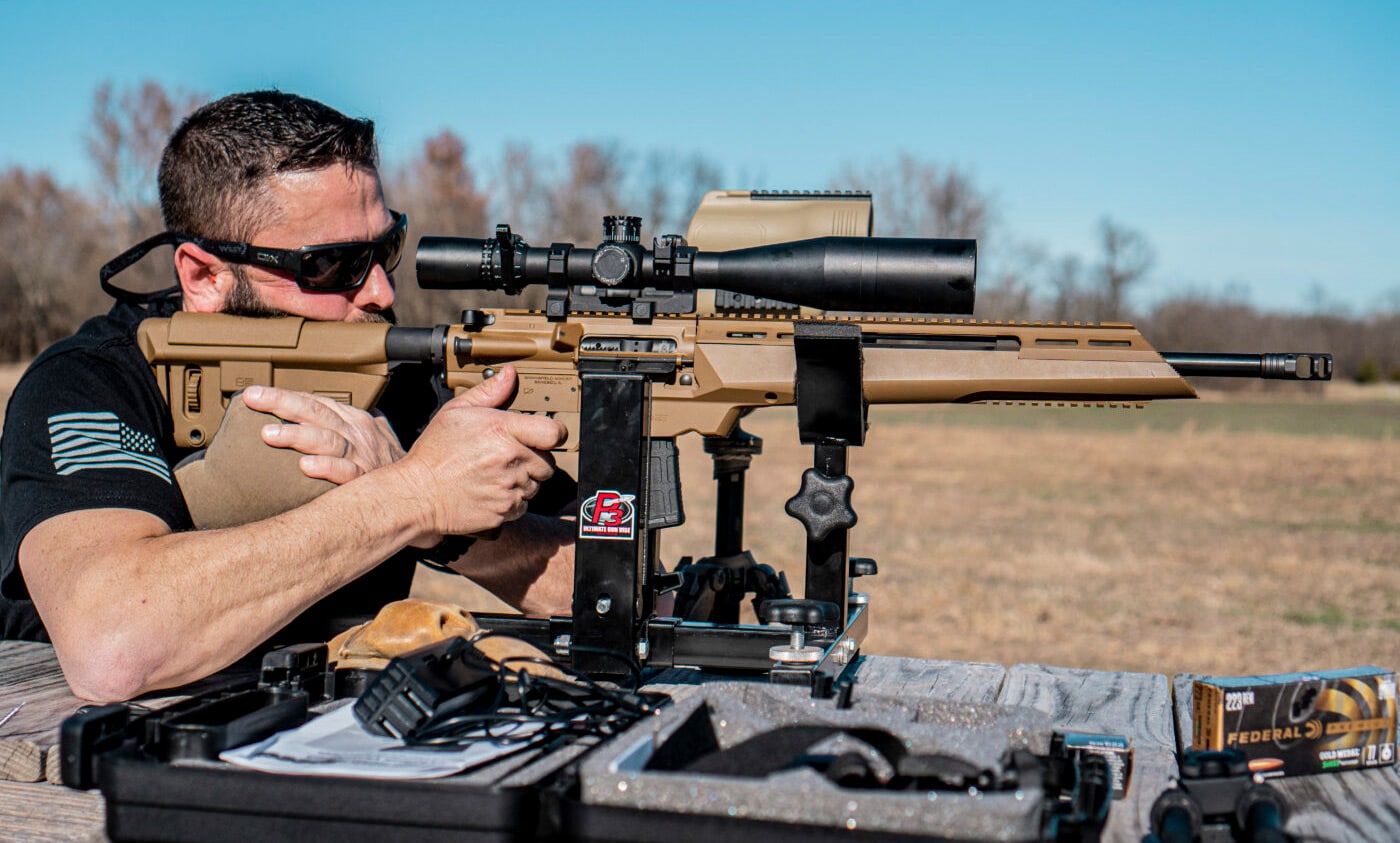 Man bench testing the SAINT Edge ATC rifle