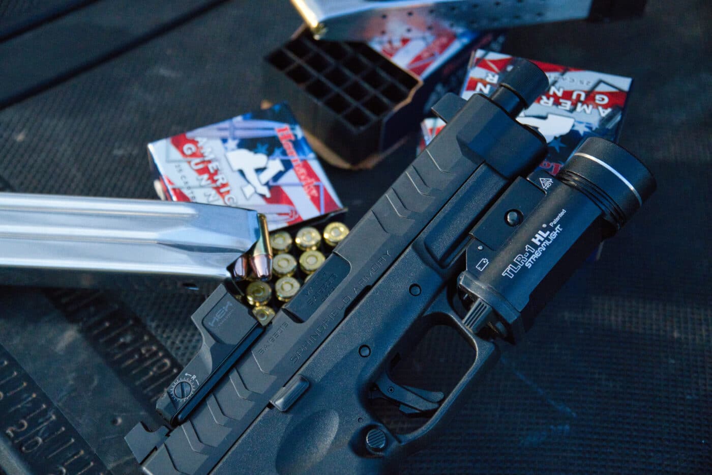 Springfield XD-M Elite pistol next to Hornady ammo