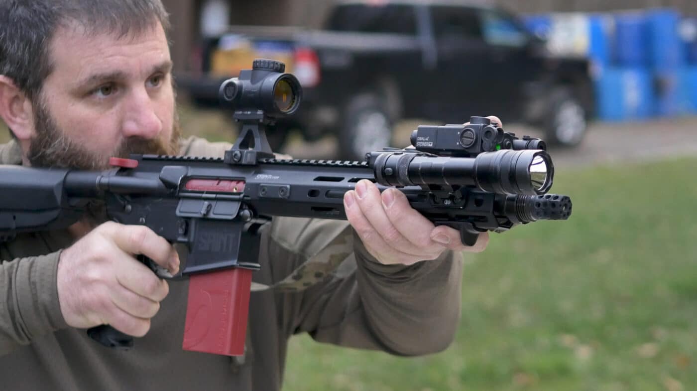 Man holding rifle with Blackbeard training system