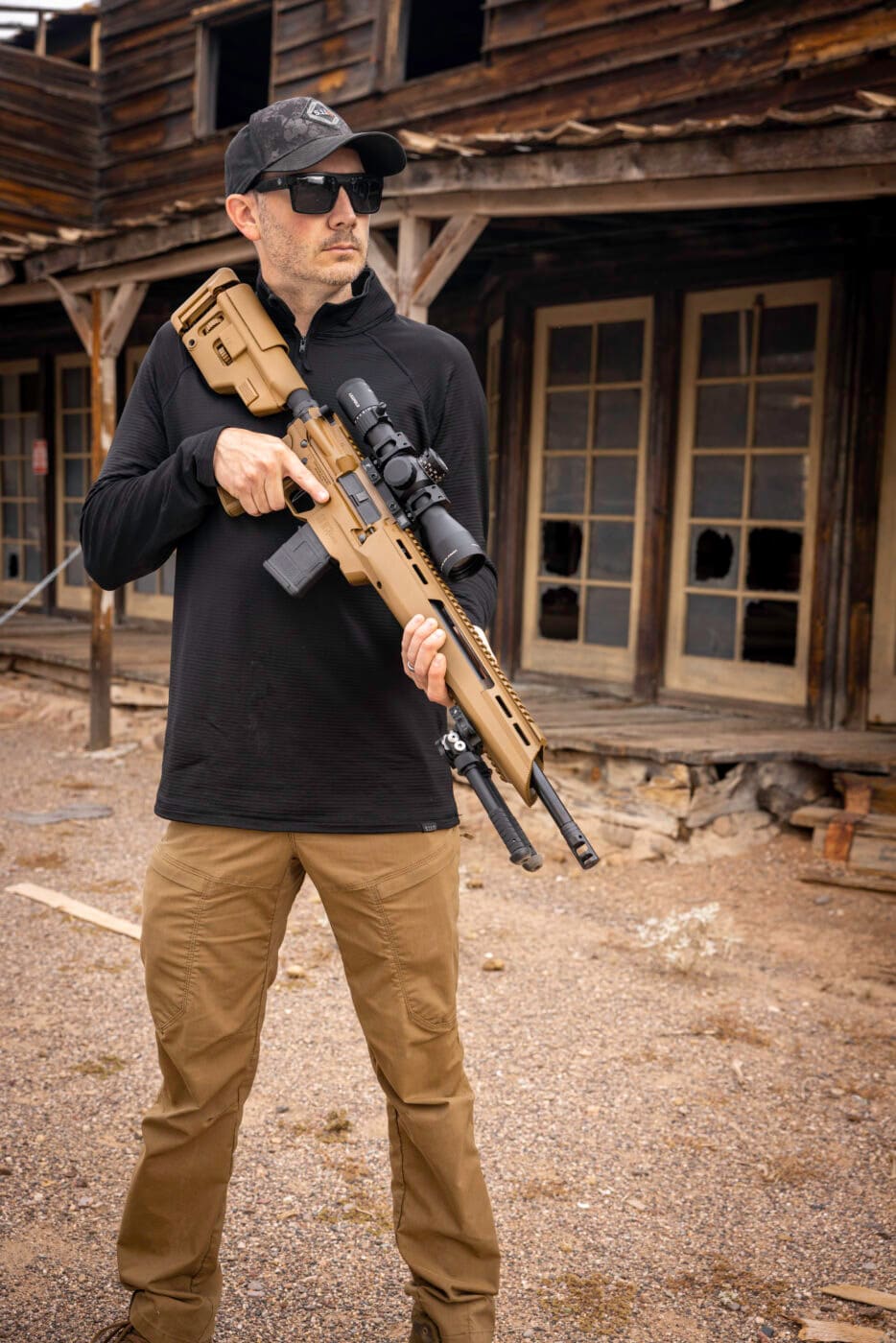Man holding a SAINT Edge ATC rifle