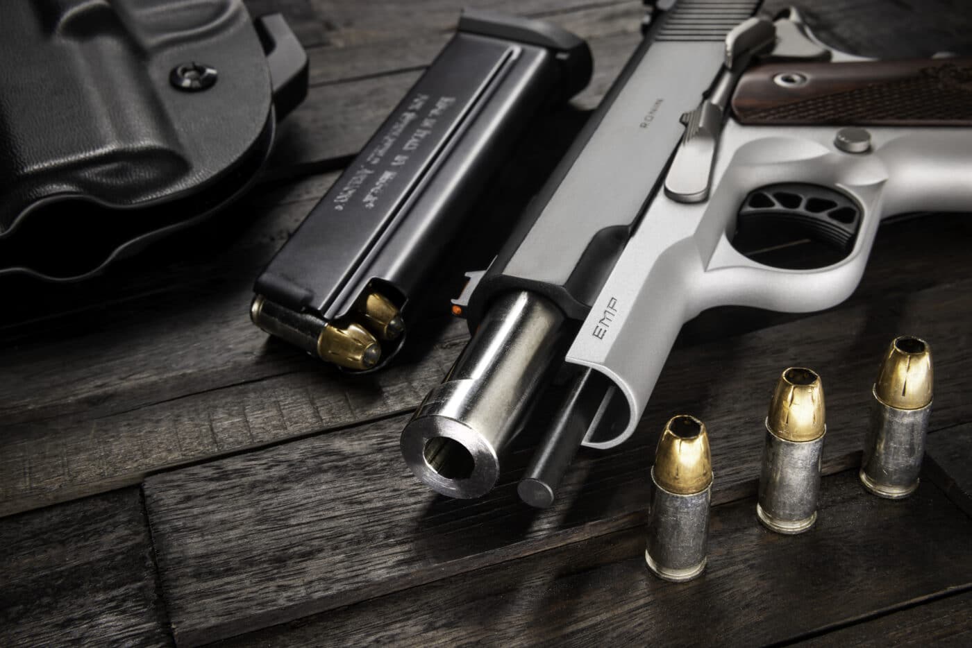 Springfield Ronin EMP pistol on a table with a magazine and ammo