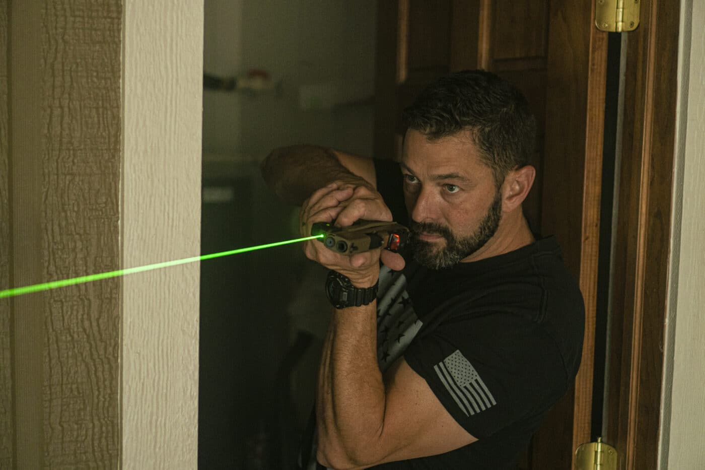 Man moving through the fatal funnel with a pistol