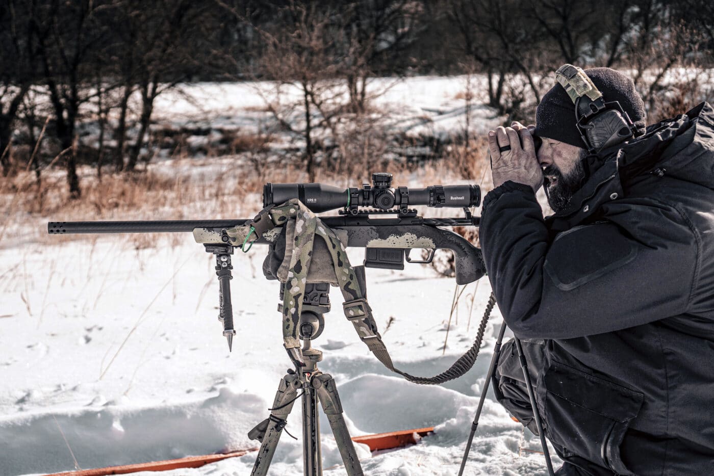 Man preparing for long range sniper shot