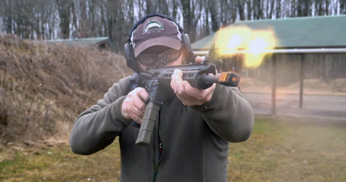 Man shooting SAINT Edge rifle with black nitride barrel