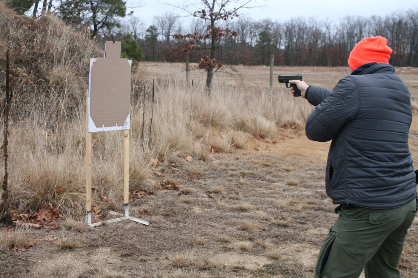 Man point shooting target one handed