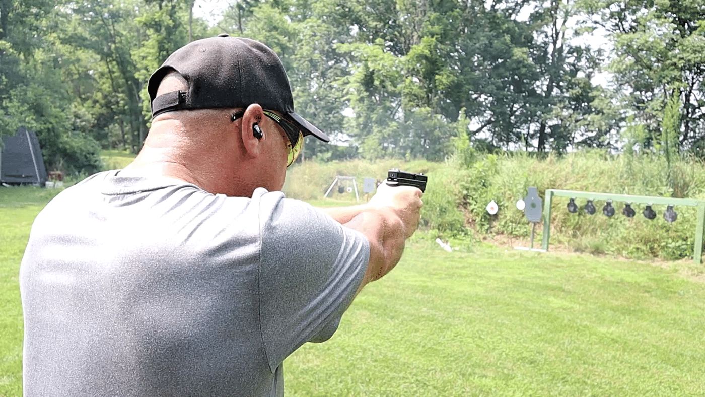 Man running a plate rack with a .40 XD pistol