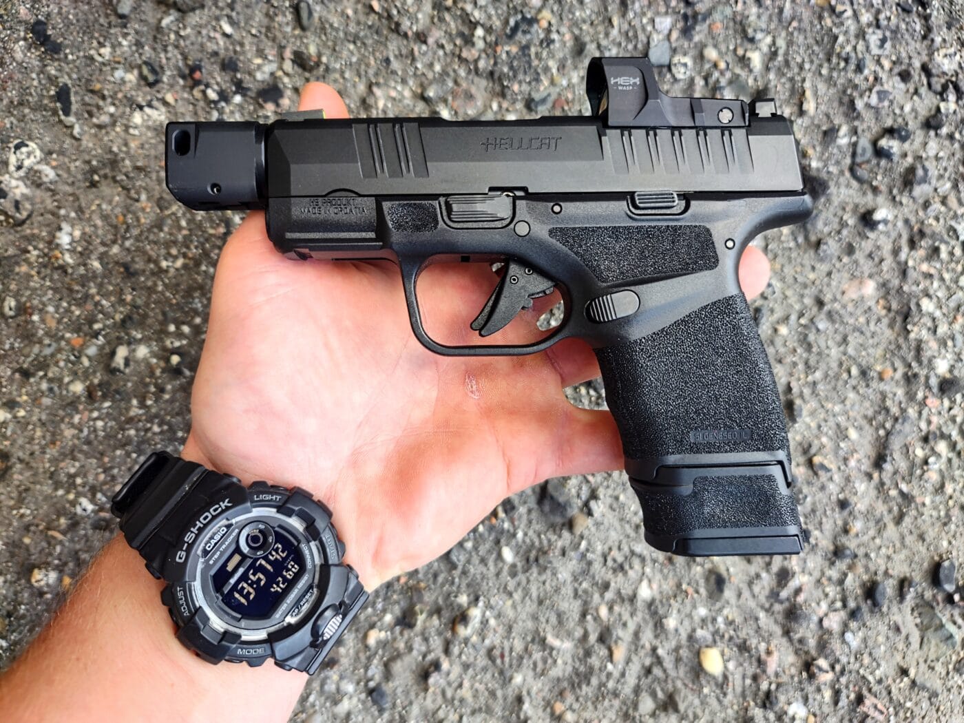 Hellcat RDP pistol in the palm of a person's hand