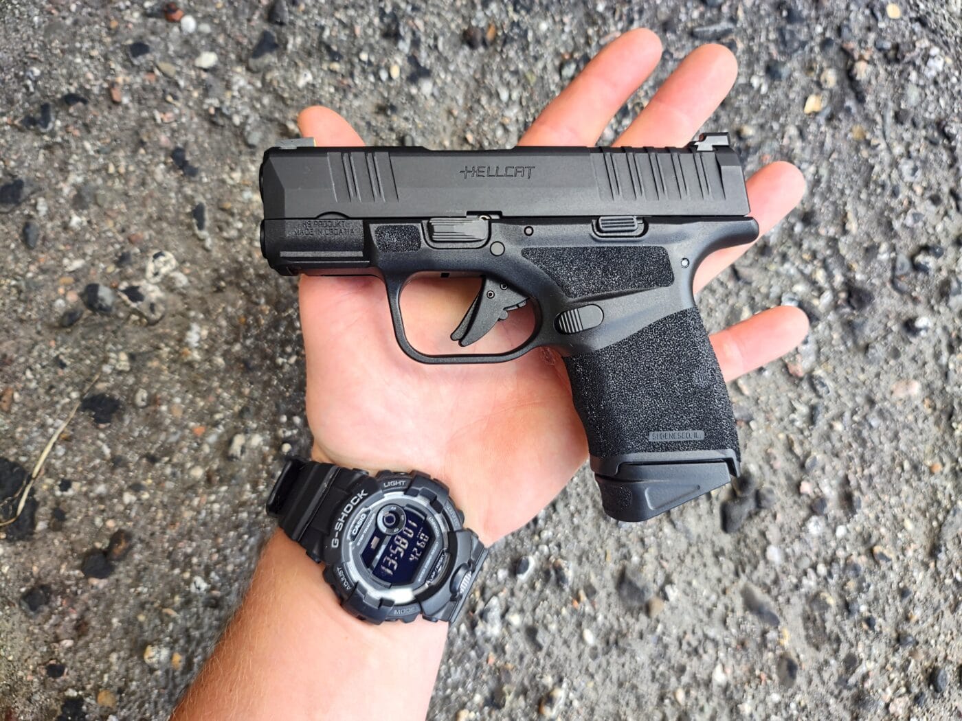 Springfield Hellcat sitting in the palm of a person's hand