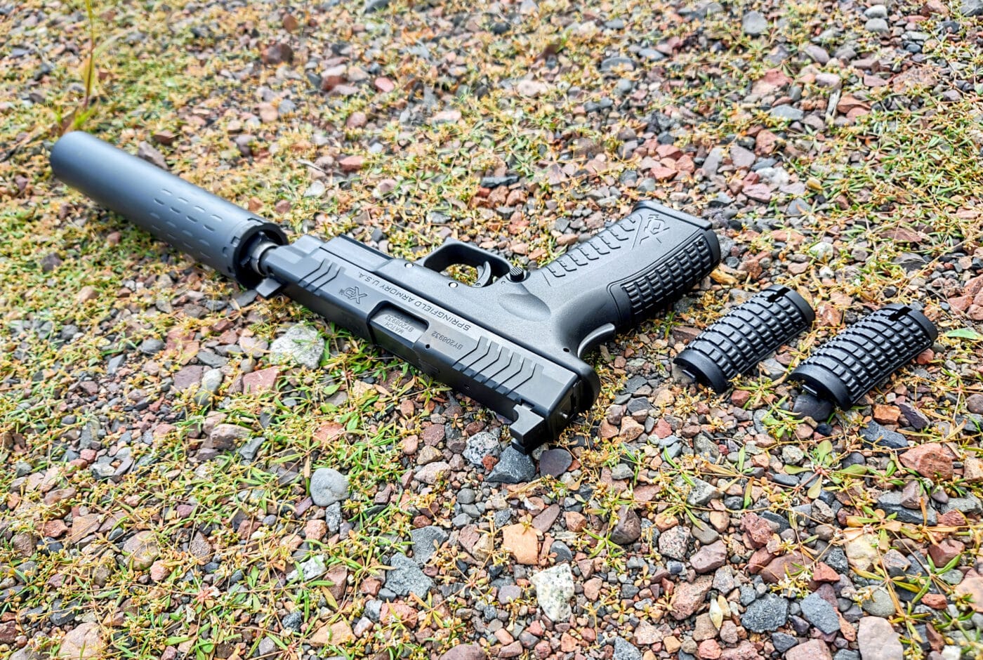 Springfield Armory XD-M with suppressor and extra backstraps