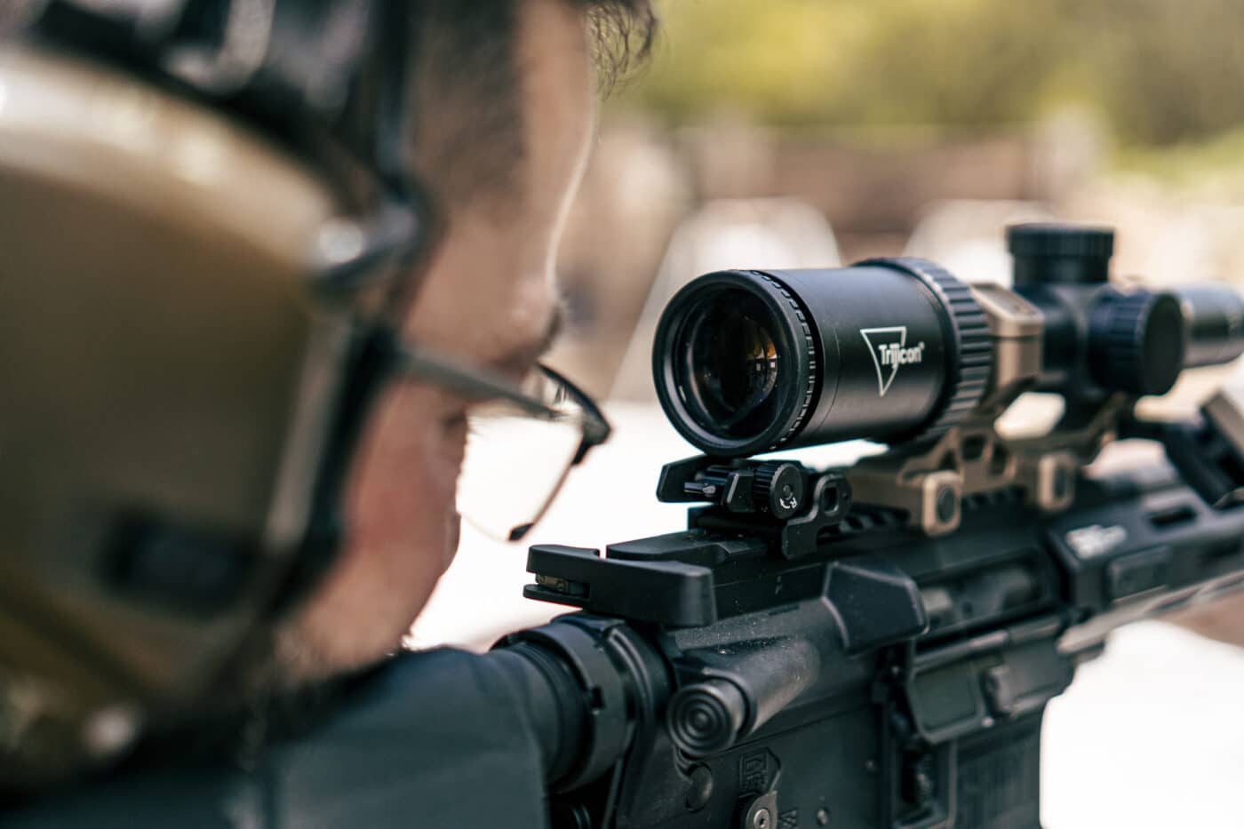 Man demonstrating eye relief in muzzle up rifle position