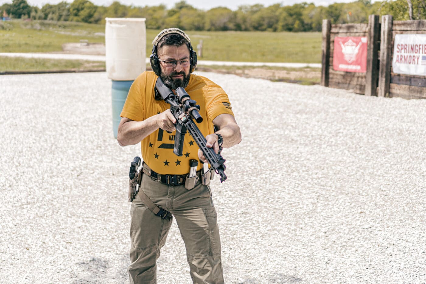 Man holding rifle in low ready position