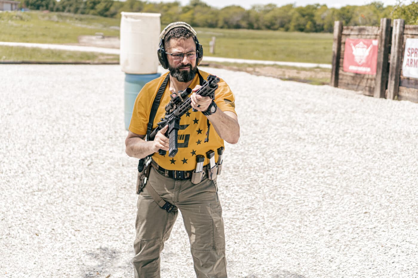 Man holding rifle in muzzle up position