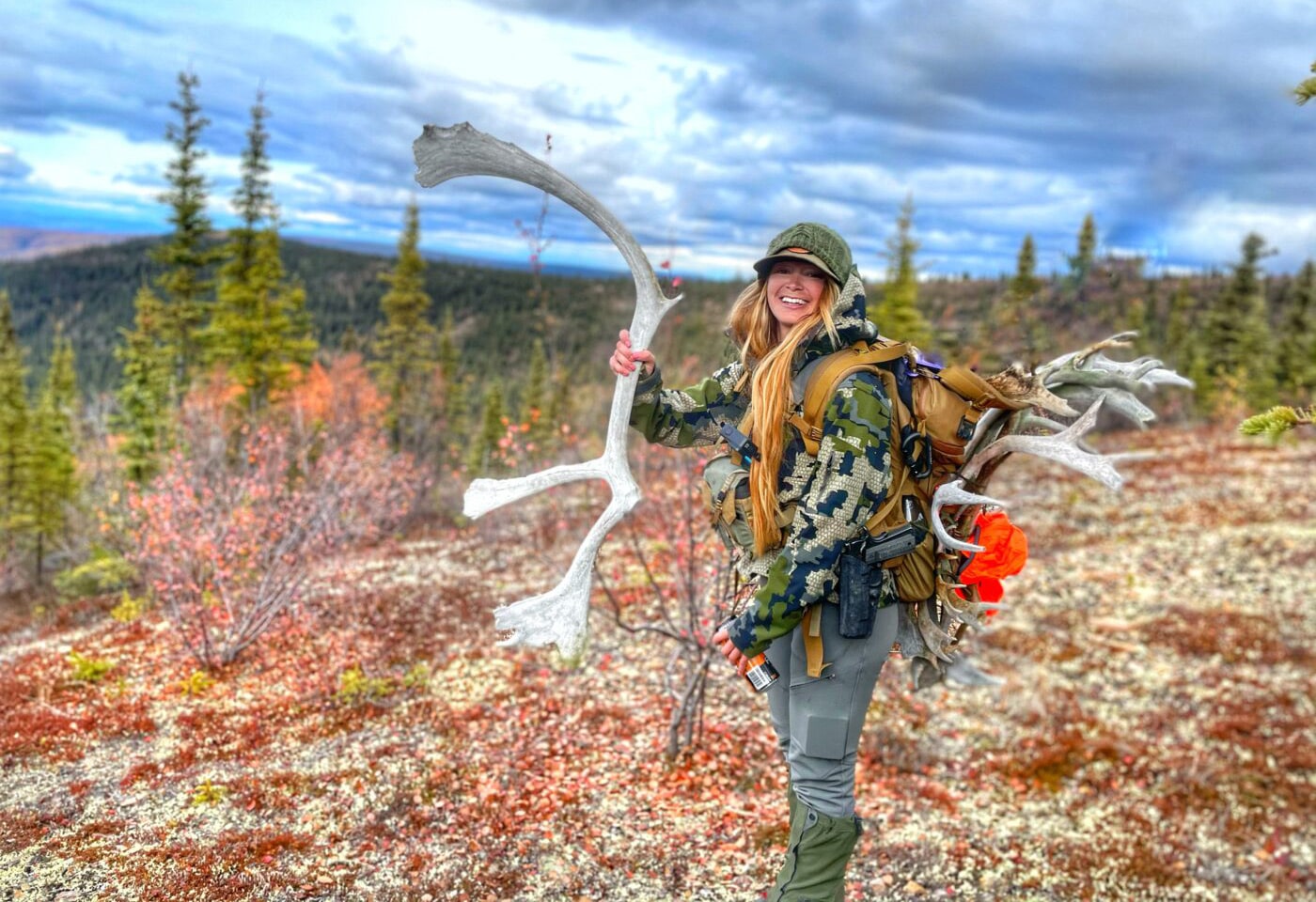 Woman solo caribou hunting in Alaska