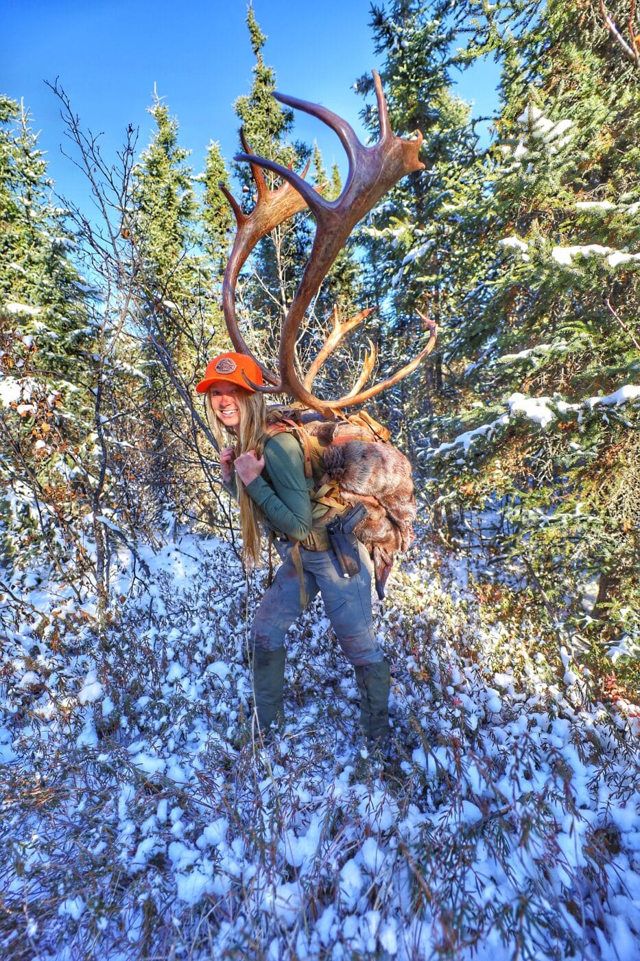 Woman carrying caribou meat