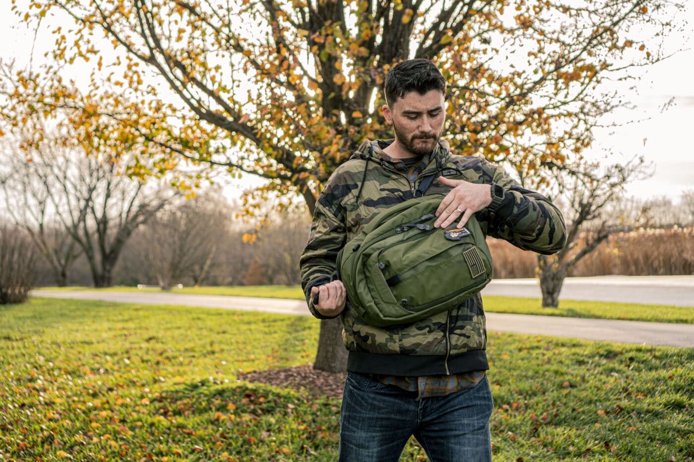 Man accessing firearm in a Vertx pack