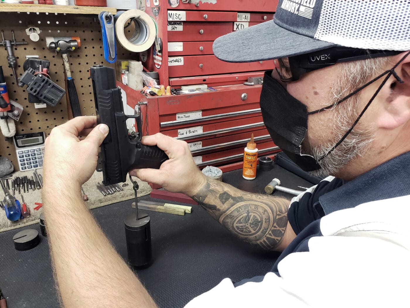 Jeremy Sides, a Custom Pistol Tech with Springfield Custom, is shown here working on Ayoob’s XD-M Elite 5.25 10mm