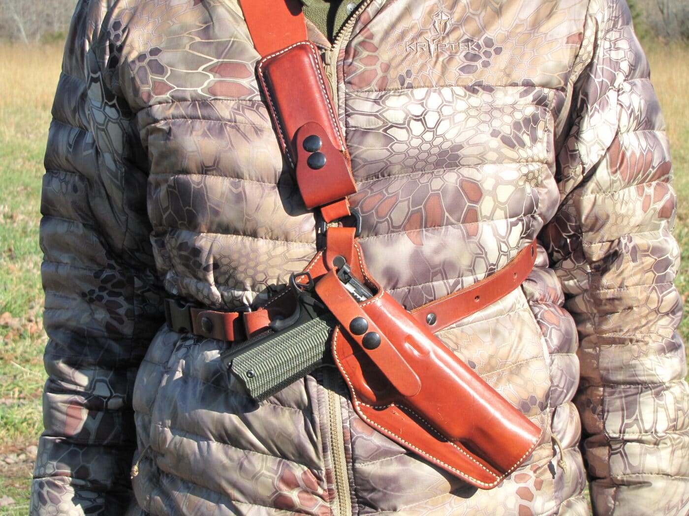 Man carrying pistol using a Diamond D Custom chest holster