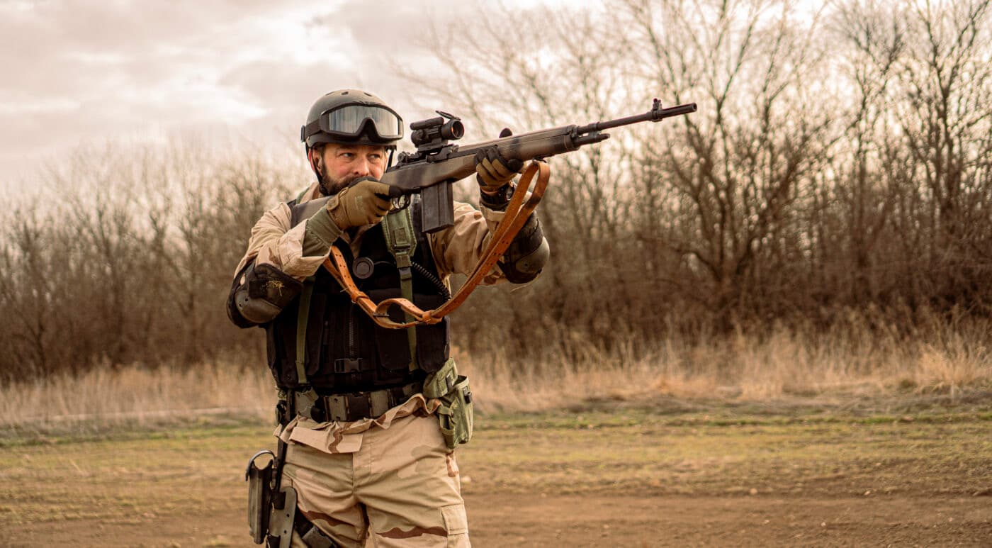 Man shooing M1A rifle made to look like the M14 rifle from the movie Black Hawk Down