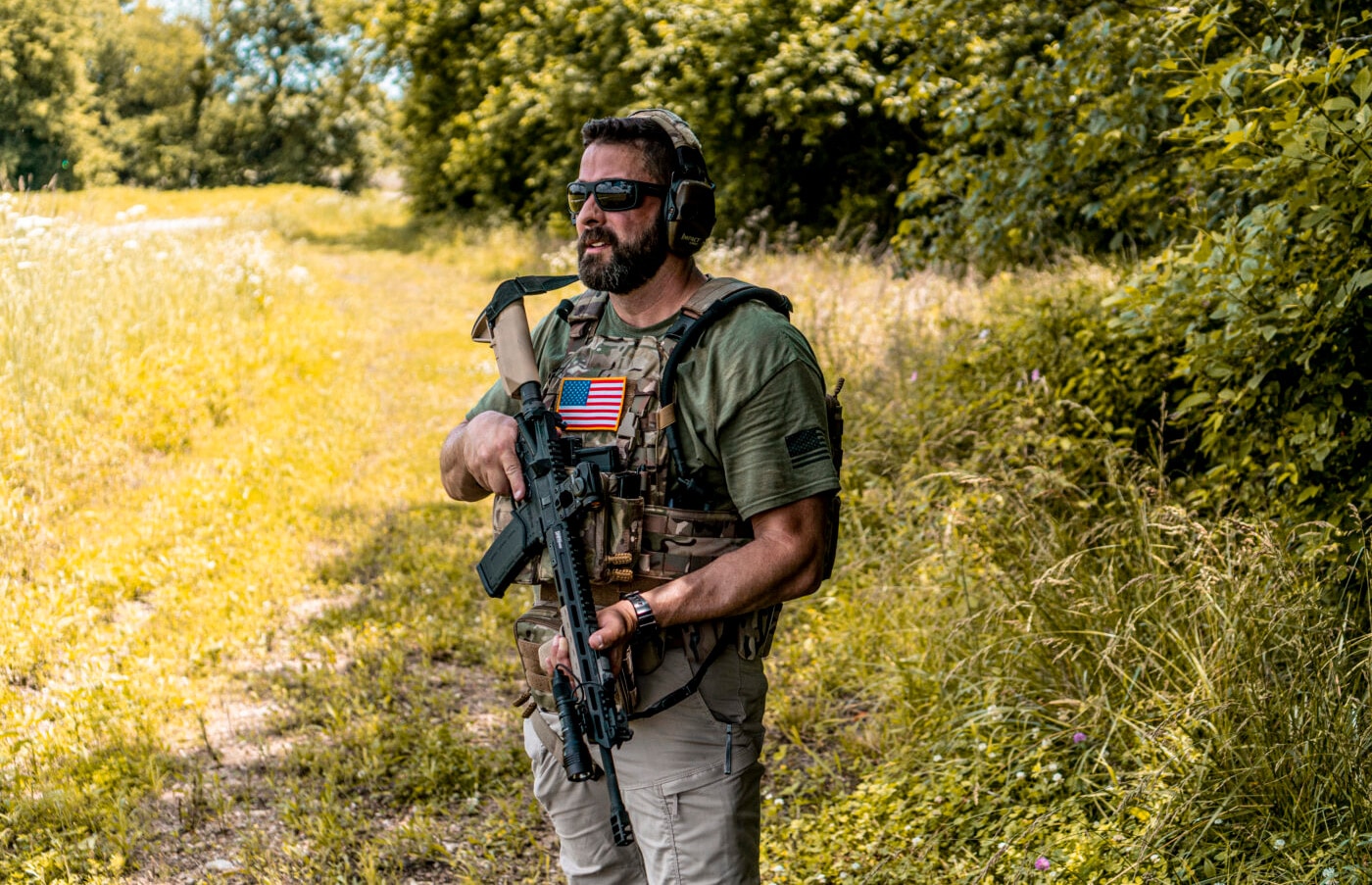 Man showing how tight should a rifle sling be