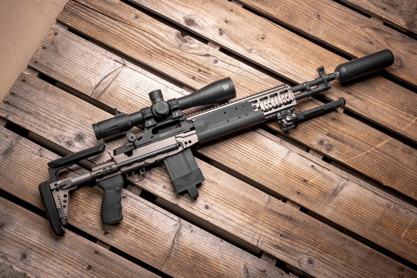 X2 Dev Group Orion-X suppressor  mounted on rifle