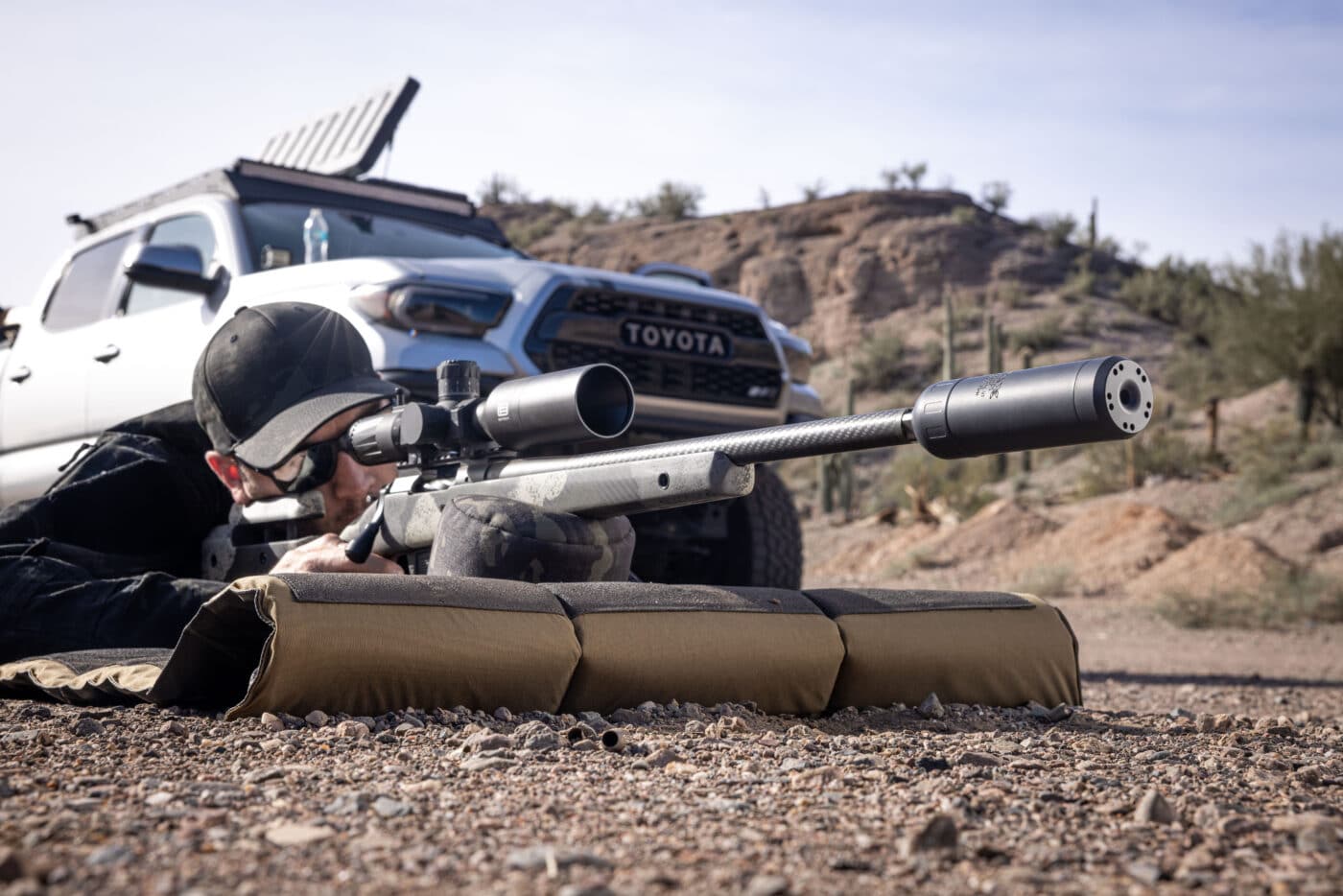 Man shooting a Springfield Waypoint rifle with an Orion-X sound suppressor