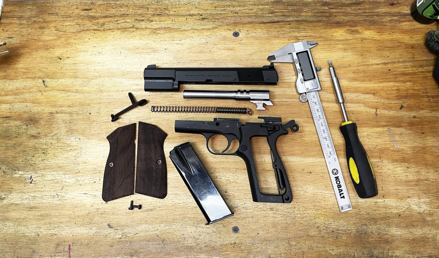 Springfield Armory SA-35 pistol disassembled on workbench