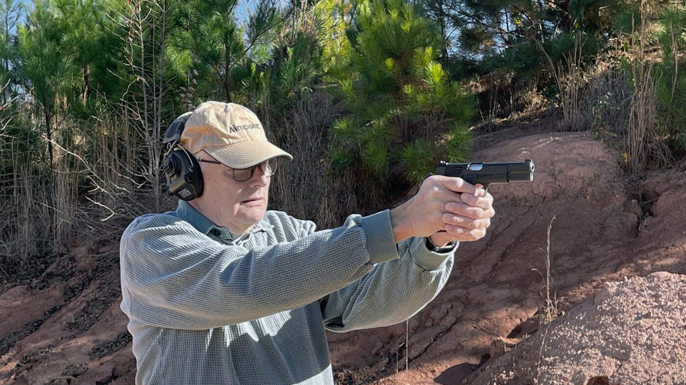 Man shooting a Springfield Armory SA-35 pistol