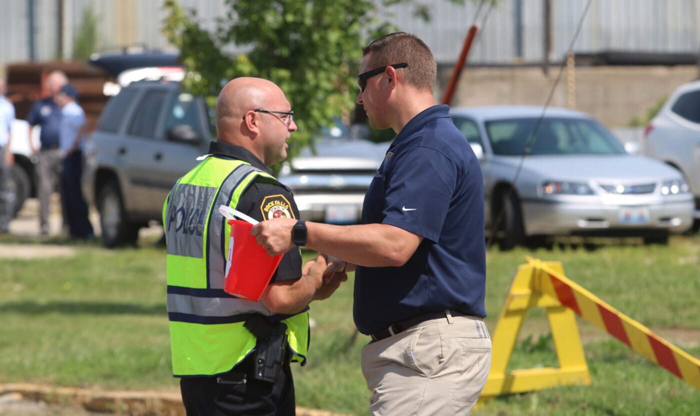 Sen. Neil Anderson talks to a cop