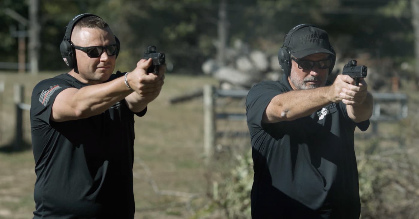 Sen. Neil Anderson and Rob Leatham shooting at the pistol range