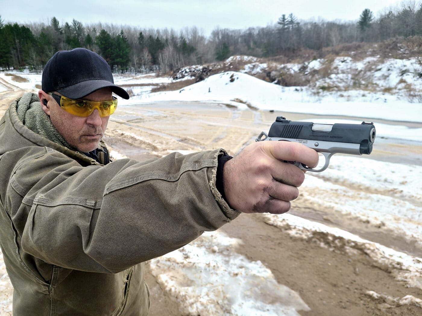 Man at range during one handed shooting training