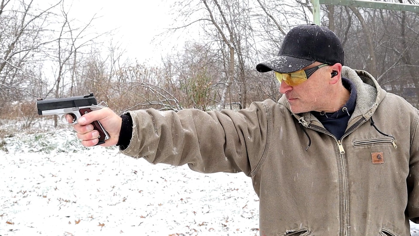 Man shooting a pistol with strong hand only