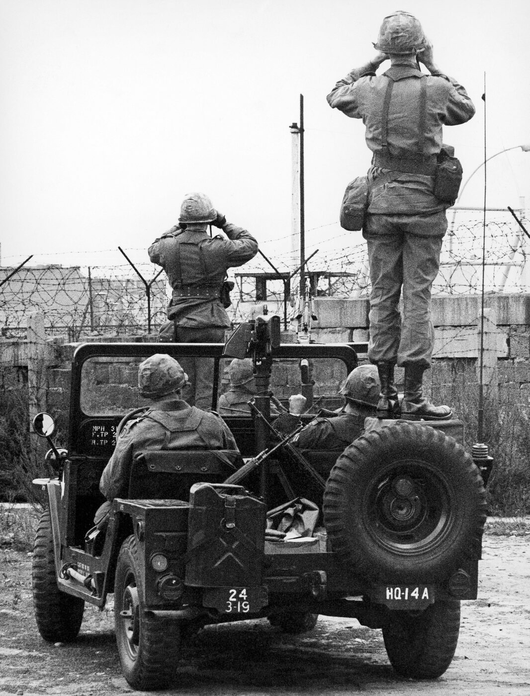 U.S. Army soldiers patrolling the Berlin Wall with M14 rifles and M60 machine guns