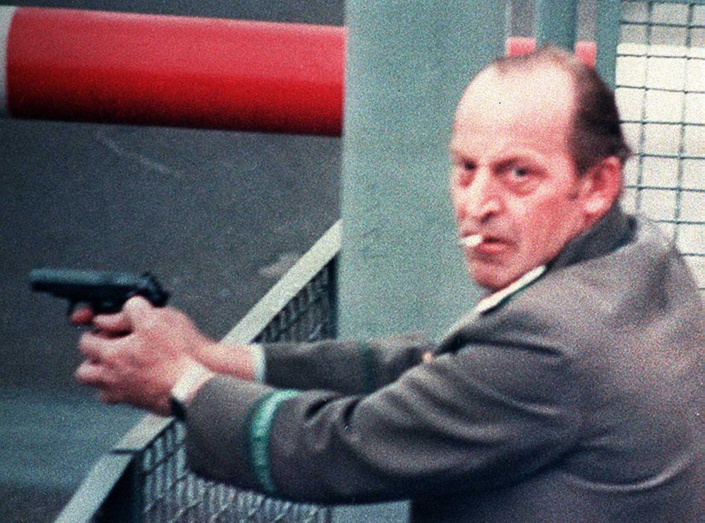 Cigarette butt man at Berlin Wall with Makarov pistol