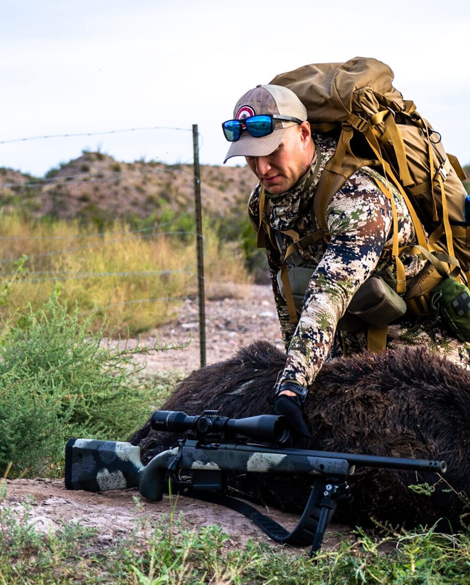 Man after tracking the hog across south Texas during a hunt