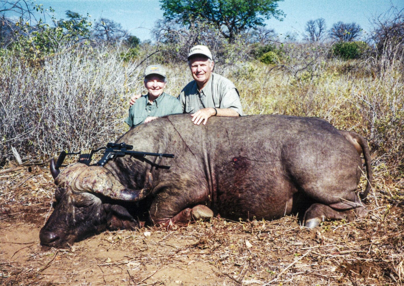 People hunting cape buffalo with SASS pistol